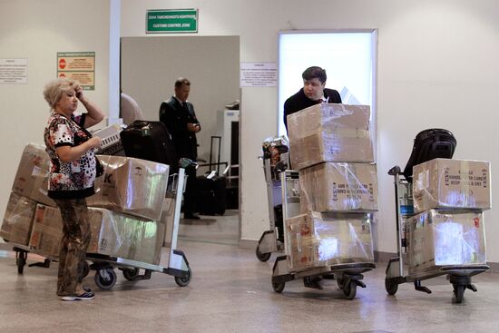 Passengers arrive at Domodedovo airport from London