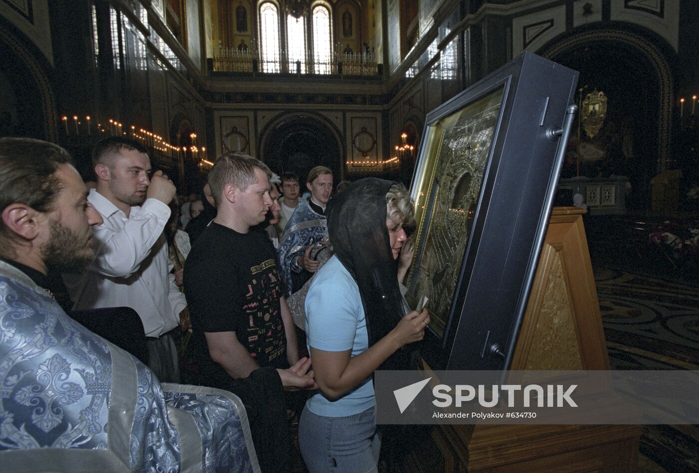 Believers near the icon of Our Lady of Tikhvin