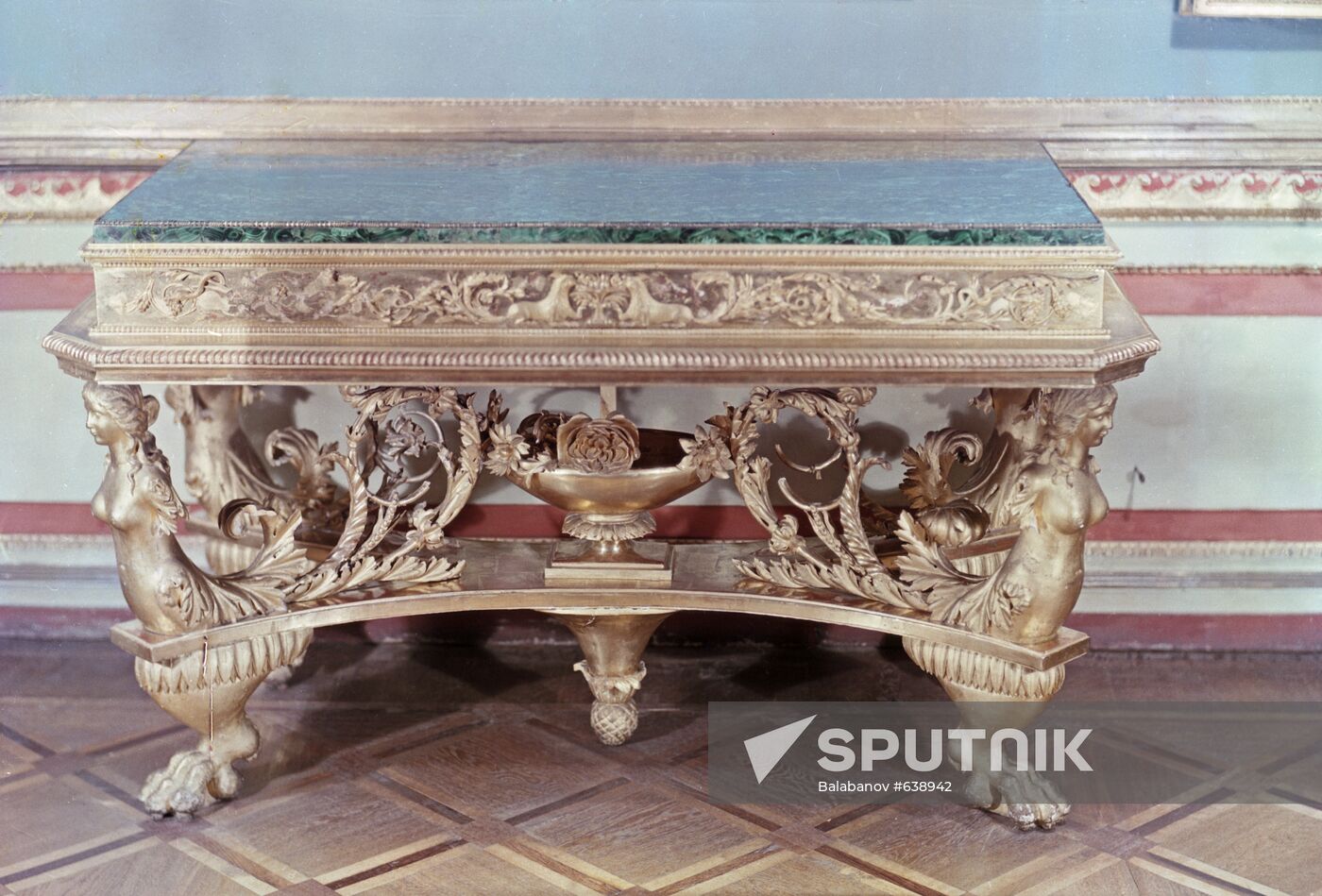 Carved gilded table with malachite top