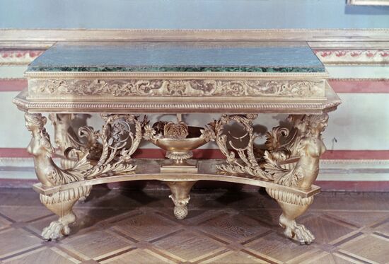 Carved gilded table with malachite top