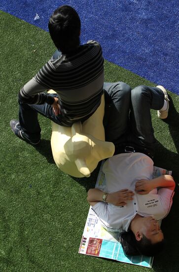 Visitors attend Shanghai World Expo 2010