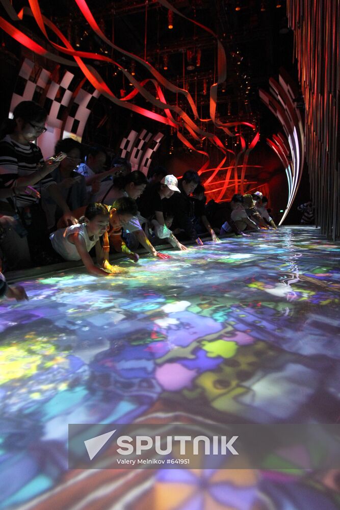 Visitors view Canada Pavilion exhibit at World Expo 2010