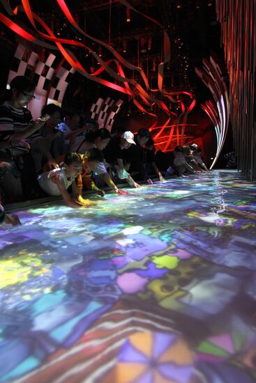 Visitors view Canada Pavilion exhibit at World Expo 2010