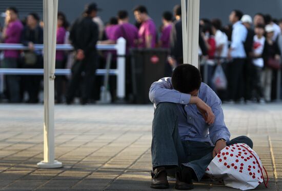 Visitors attend Shanghai World Expo 2010