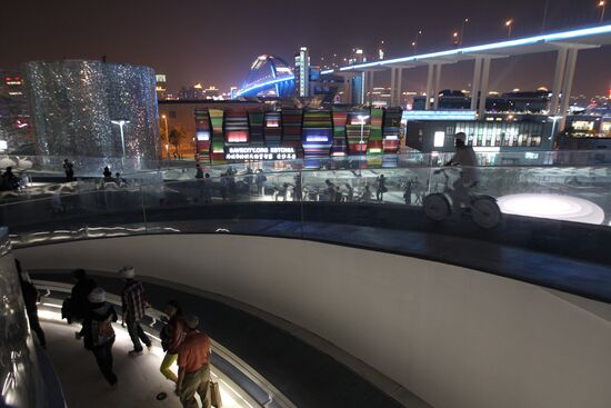 Visitors view items displayed at Denmark Pavilion at Expo 2010