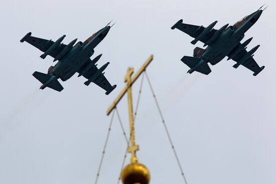 Military aircraft fly over Red Square