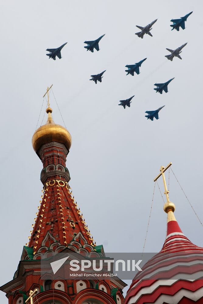 Military aircraft fly over Red Square