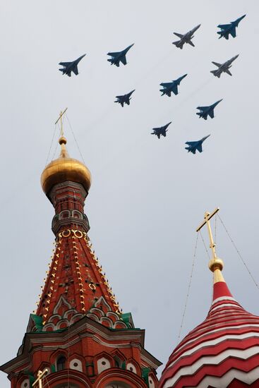 Military aircraft fly over Red Square