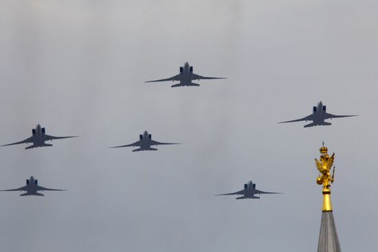Military aircraft fly over Red Square