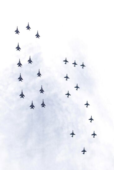 Military aircraft fly over Red Square