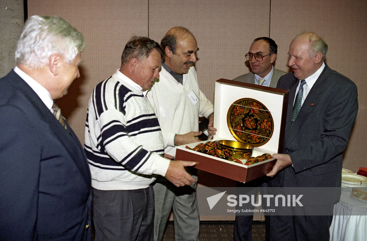 Yegor Stroyev giving a present