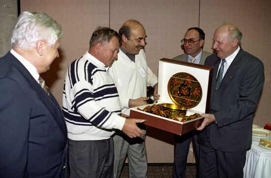 Yegor Stroyev giving a present