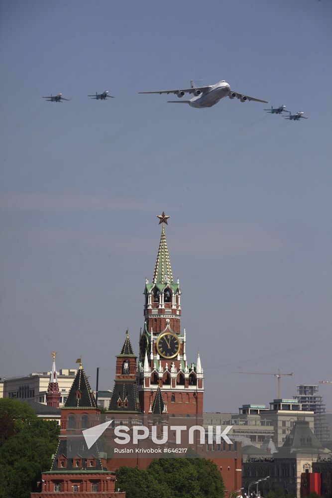 Military aircraft fly over Red Square