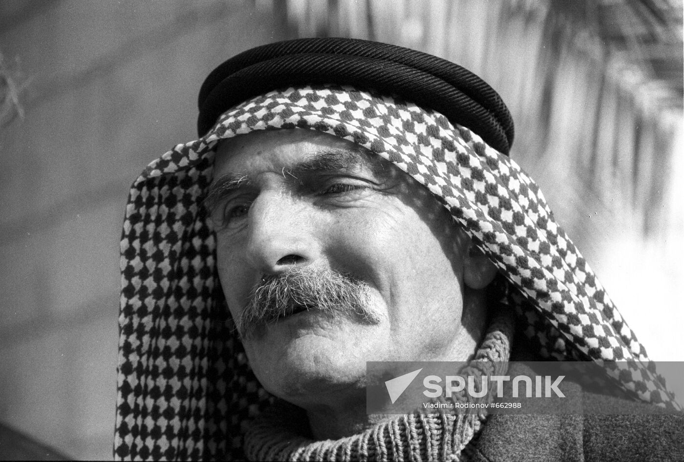 Arab man wearing Arafat scarf