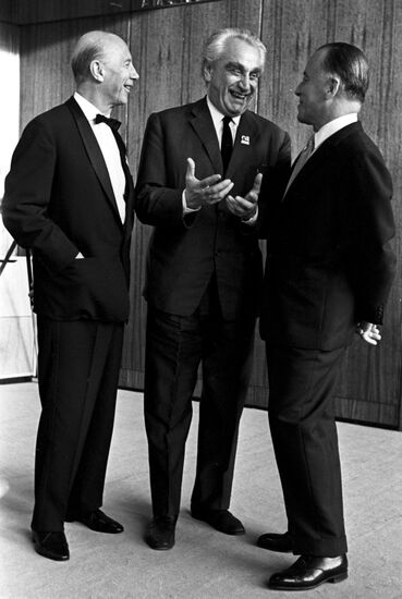 Soviet film director Grigory Alexandrov talks with Germany guests Guenter Schwarz and German Schwerin