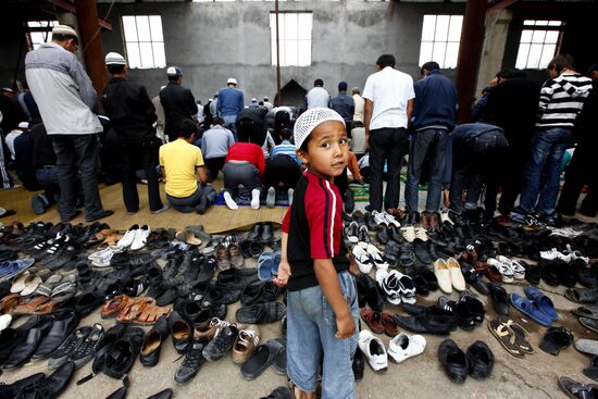 Believers attending Friday prayer at Uzbek community's mosque