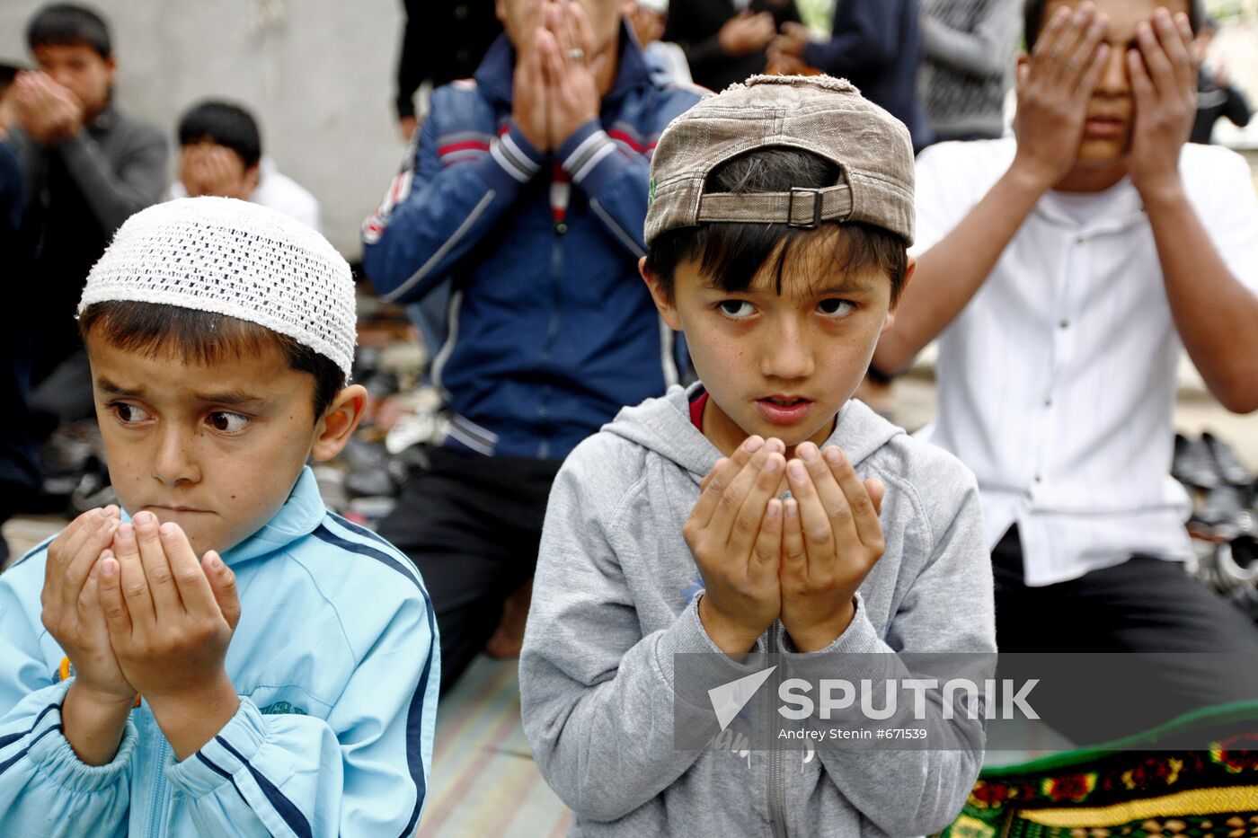 Believers attending Friday prayer at Uzbek community's mosque