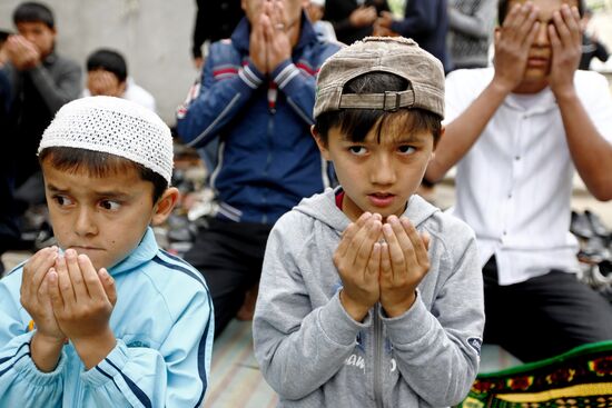 Believers attending Friday prayer at Uzbek community's mosque