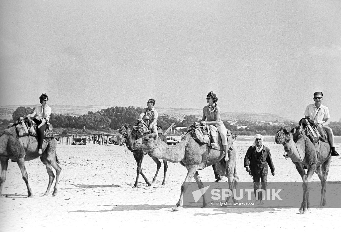 Tourists aboard camels