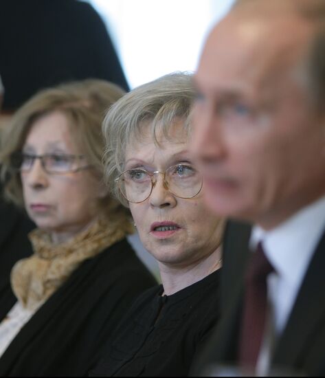 Vladmir Putin with "Little Prince" charity organizers