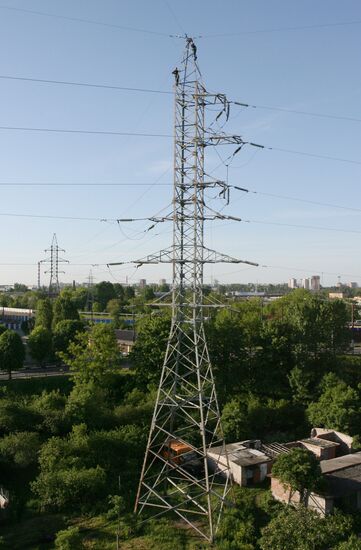 Worker executing repairs at power transmission lines