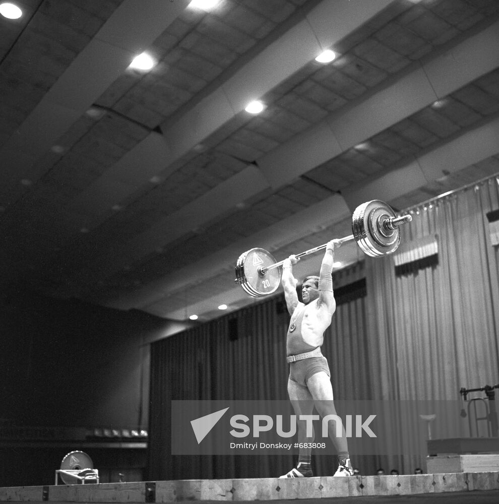 Power lifter Vasily Kolotov performing exercise