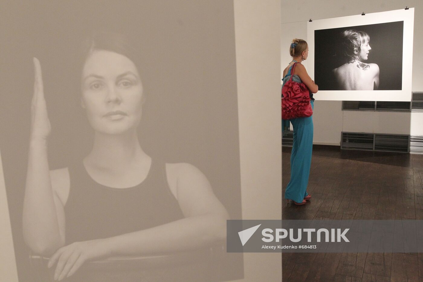 A visitor at No Make-Up exhibition by Vlad Loktev