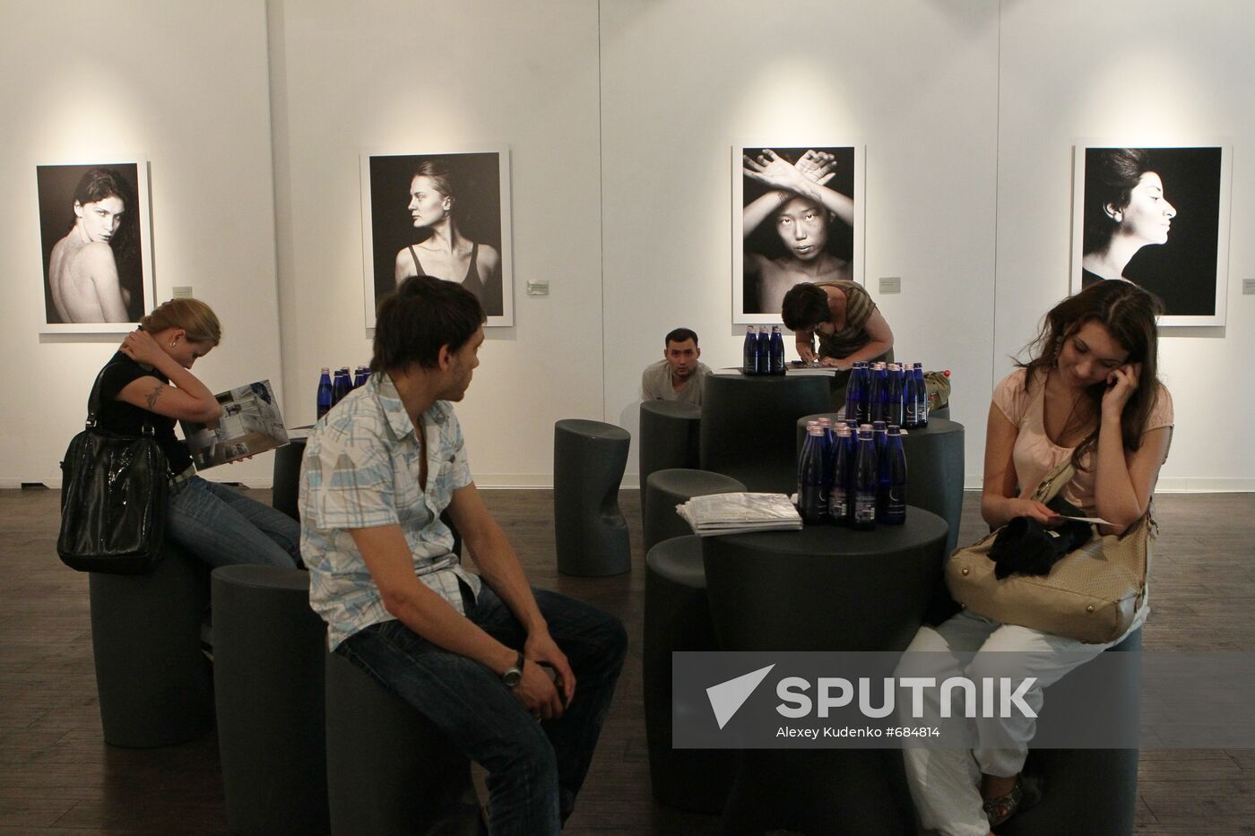 Visitors at No Make-Up photo exhibition by Vlad Loktev