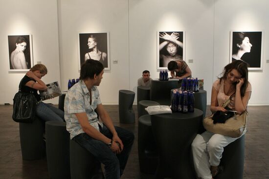 Visitors at No Make-Up photo exhibition by Vlad Loktev