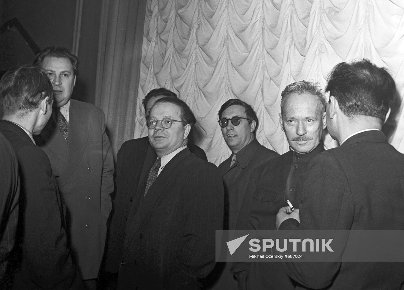 Writer Mikhail Sholokhov among colleagues