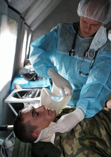 First medical aid in combat area training exercises.