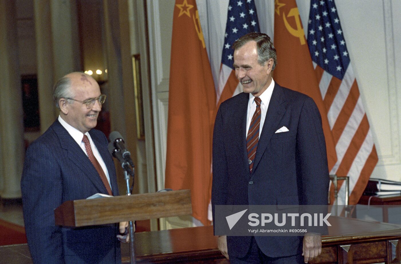 Mikhail Gorbachev and George H.W. Bush after signing documents