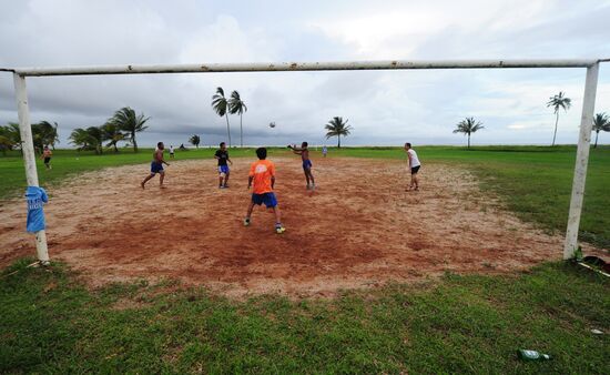 Citizens of Kourou playing football