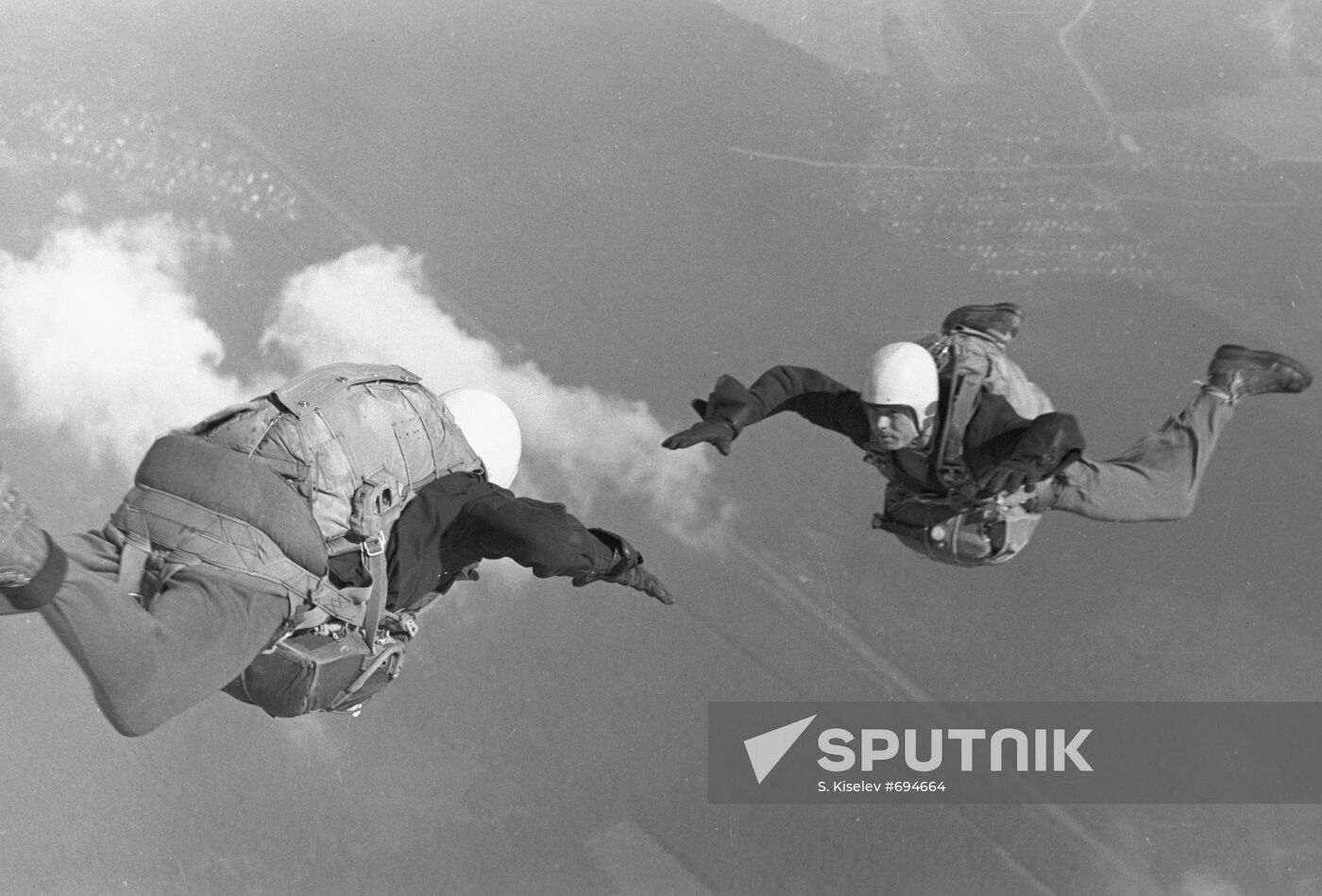 Soviet parachute jumpers performing a group jump