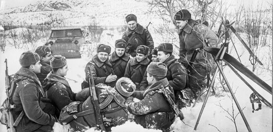 Soviet soldiers listen to political commissar