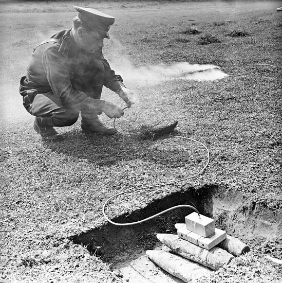 Engineer sets fire to safety fuse