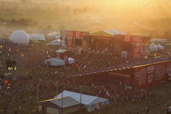 Visitors attend Nashestviye rock festival