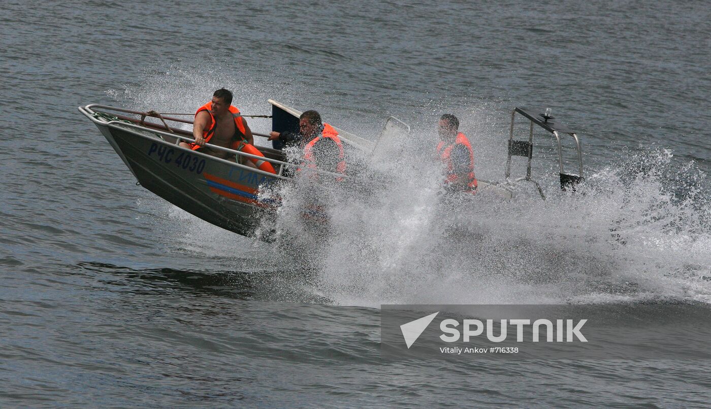 Emergency inspectors engage in powerboat competition