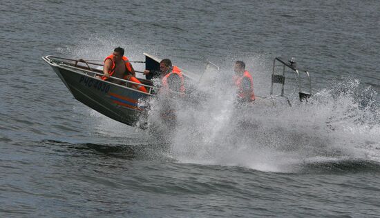 Emergency inspectors engage in powerboat competition