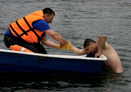 Emergency inspectors engage in lifesaving relay