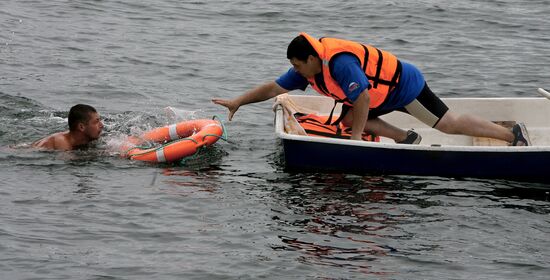 Emergency inspectors engage in lifesaving relay