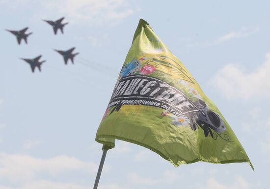 Music fans watch air show at Nashestviye 2010 rock festival