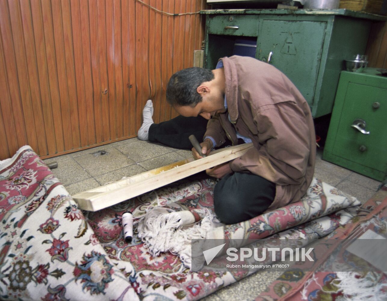 Young people weaving expensive carpets