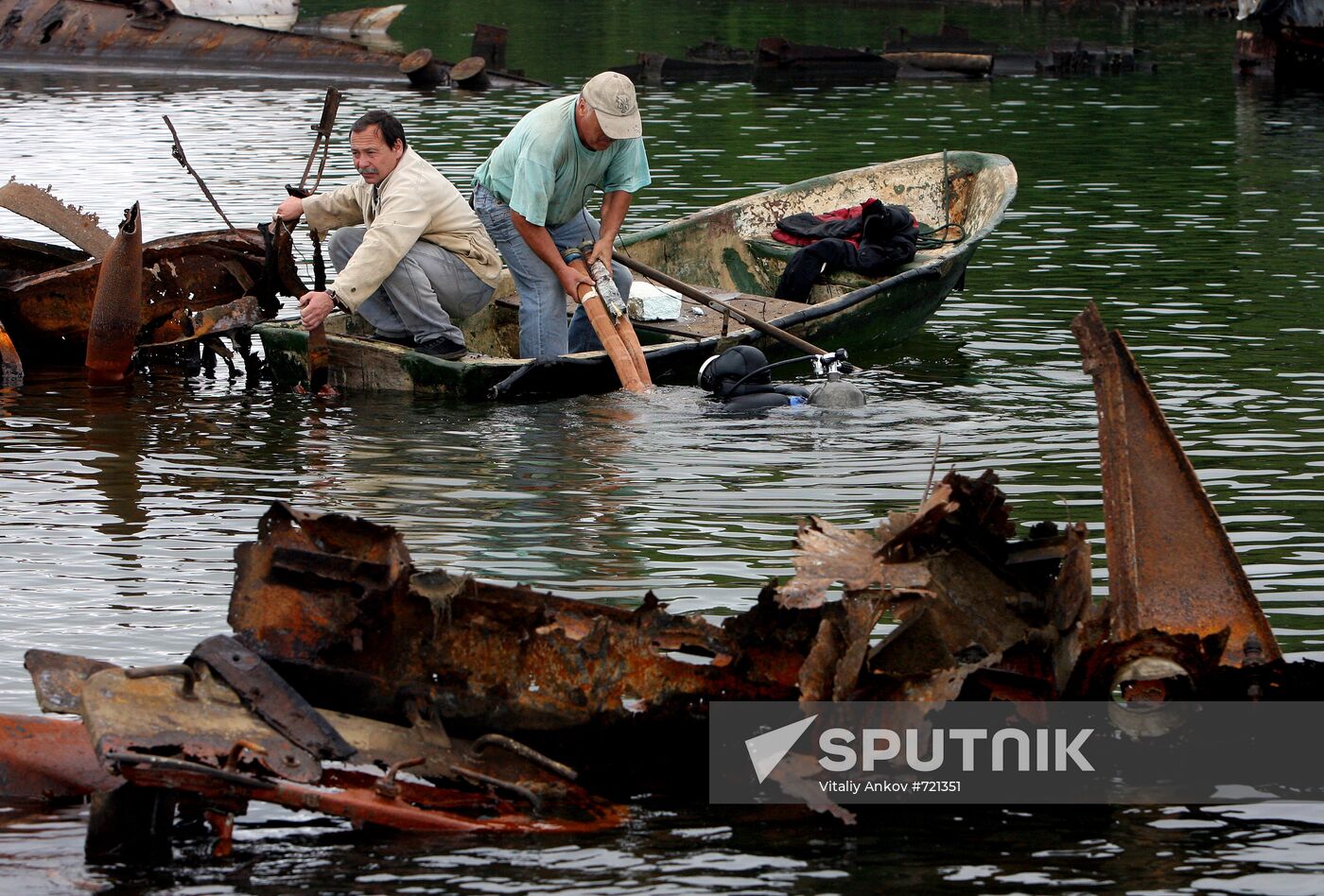 Utility crews engage in boat debris cleanup at Novik Bay