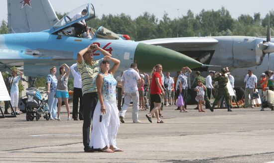 Visitors attend military aircraft exhibition