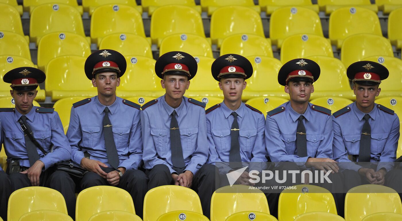 Police officers sitting on stands
