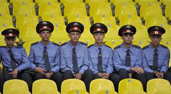 Police officers sitting on stands