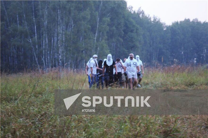 Masked persons in Khimki forest