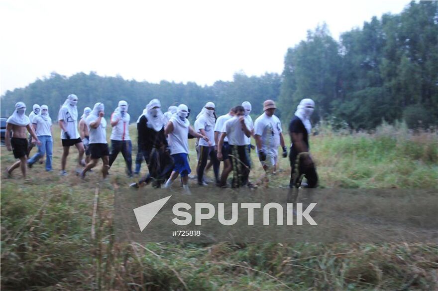 Masked persons in Khimki forest
