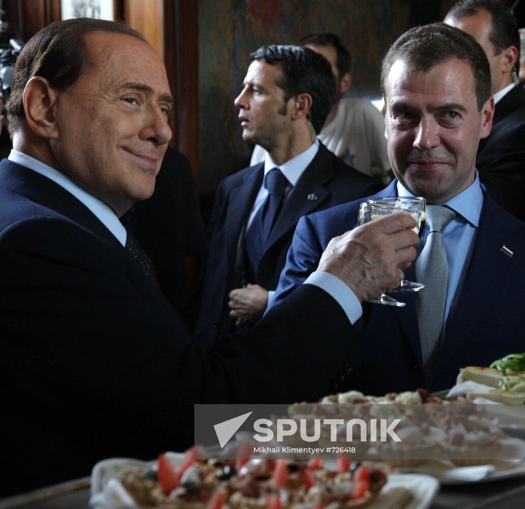 Dmitry Medvedev and Silvio Berlusconi take walk in Milan